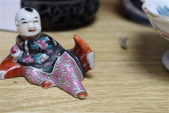 Two Chinese famille rose dishes, a figure of a boy, a porcelain brush pot and a bamboo brush pot tallest 28cm